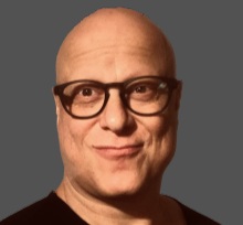 Tobias Bartel Profilbild, es ist Tobias Bartel auf grauem Hintergrund zu sehen